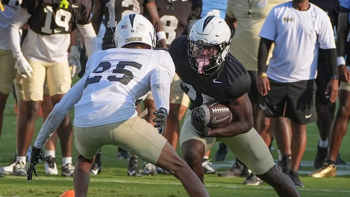 UCF running back Agyeman Addae competes with Rukeem Stroud during UCF Spring football practice at FBC Mortgage Stadium in Orlando, Friday, April 11, 2025. UCF running back Agyeman Addae competes with Rukeem Stroud during UCF Spring football practice at FBC Mortgage Stadium in Orlando, Friday, April 11, 2025.