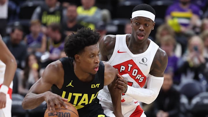 Jan 12, 2024; Salt Lake City, Utah, USA; Utah Jazz guard Collin Sexton (2) dribbles the ball defended by Toronto Raptors guard Dennis Schroder (17) during the third quarter at Delta Center. Mandatory Credit: Rob Gray-Imagn Images