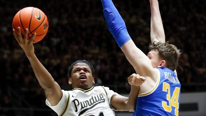 Purdue Boilermakers guard Gicarri Harris (24) shoots the ball past UCLA Bruins forward Tyler Bilodeau (34) Friday, Feb. 28, 2025, during the NCAA men’s basketball game at Mackey Arena in West Lafayette, Ind. Purdue Boilermakers won 76-66. Purdue Boilermakers guard Gicarri Harris (24) shoots the ball past UCLA Bruins forward Tyler Bilodeau (34) Friday, Feb. 28, 2025, during the NCAA men’s basketball game at Mackey Arena in West Lafayette, Ind. Purdue Boilermakers won 76-66.