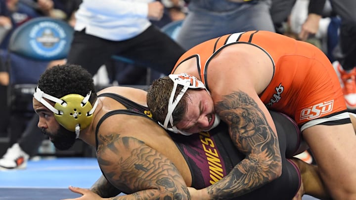 Mar 22, 2025; Philadelphia, PA, USA; Wyatt Hendrickson of the Oklahoma State Cowboys wrestles defeating Gable Steveson of the Minnesota Golden Gophers during the Division I Men's Wrestling Championship held at Wells Fargo Center. Mandatory Credit: Eric Hartline-Imagn Images