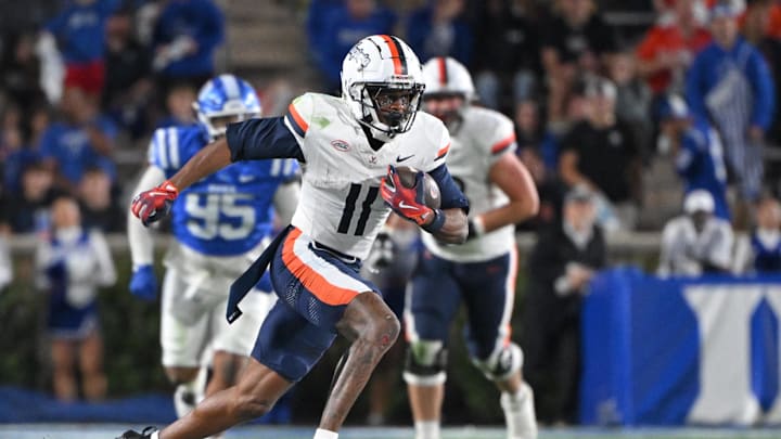 Nov 15, 2025; Durham, North Carolina, USA;  Virginia Cavaliers wide receiver Trell Harris (11) runs the ball during the third quarter against the Duke Blue Devils at Wallace Wade Stadium. Mandatory Credit: Zachary Taft-Imagn Images