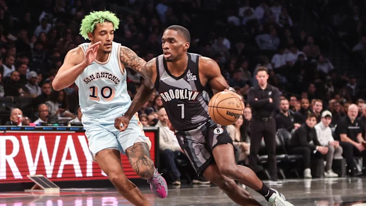 Dec 27, 2024; Brooklyn, New York, USA; Brooklyn Nets guard Shake Milton (7) drives past San Antonio Spurs forward Jeremy Sochan (10) in the third quarter at Barclays Center. Mandatory Credit: Wendell Cruz-Imagn Images Dec 27, 2024; Brooklyn, New York, USA; Brooklyn Nets guard Shake Milton (7) drives past San Antonio Spurs forward Jeremy Sochan (10) in the third quarter at Barclays Center. Mandatory Credit: Wendell Cruz-Imagn Images