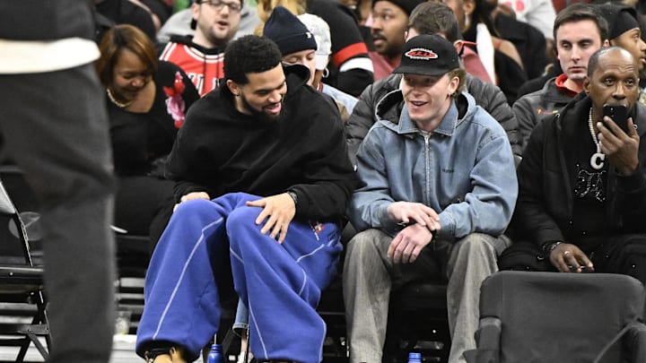 Jan 20, 2026; Chicago, Illinois, USA; Chicago Bears quarterback Caleb Williams, left, and Chicago Cubs outfielder Pete Crow-Armstrong are seen during the first half of the game between the Chicago Bulls and the LA Clippers at United Center. Mandatory Credit: Matt Marton-Imagn Images