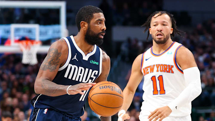 Jan 11, 2024; Dallas, Texas, USA;  Dallas Mavericks guard Kyrie Irving (11) dribbles as New York Knicks guard Jalen Brunson (11) defends during the second half at American Airlines Center. Mandatory Credit: Kevin Jairaj-Imagn Images