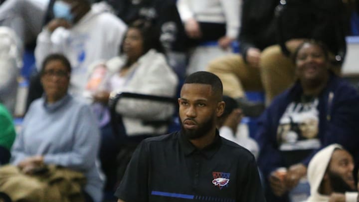 Pine Forest head coach Ty McCants keeps an eye on the court during the Pine Forest at Booker T. Washington boys basketball game on Friday, Dec. 13, 2024.