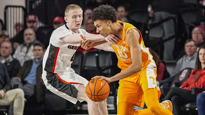 Jan 28, 2026; Athens, Georgia, USA; Tennessee Volunteers forward Nate Ament (10) dribbles against Georgia Bulldogs guard Blue Cain (0) at Stegeman Coliseum. Mandatory Credit: Dale Zanine-Imagn Images