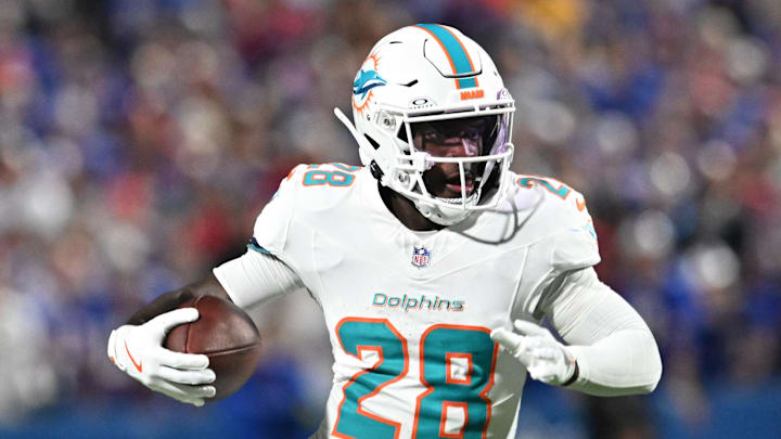 Miami Dolphins running back de'von Achane (28) runs against the Buffalo Bills in the first half at Highmark Stadium. 