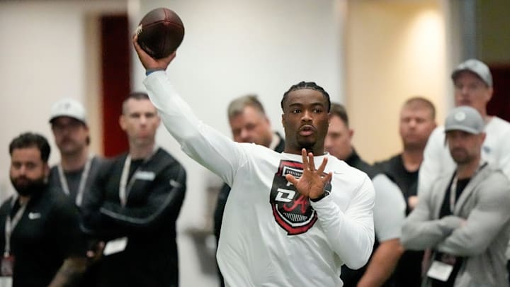 Mar 19, 2025; Tuscaloosa AL, USA; Quarterback Jalen Milroe throws for scouts at the University of Alabama Pro Day as several Crimson Tide players worked out for NFL teams in the Hank Crisp Indoor Practice Facility.