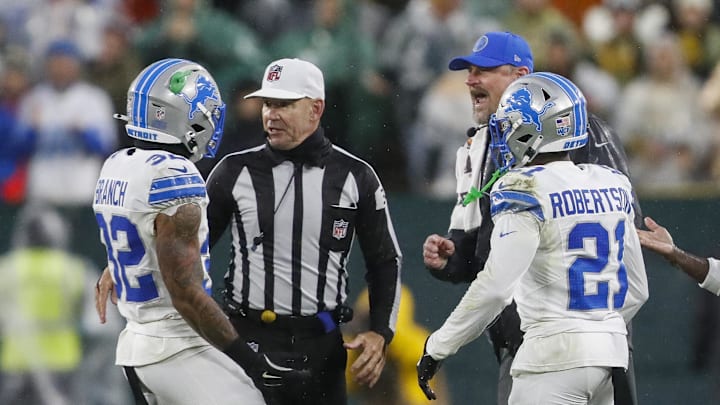 Detroit Lions head coach Dan Campbell addressing Brian Branch (32) being ejected against Green Bay Packers
