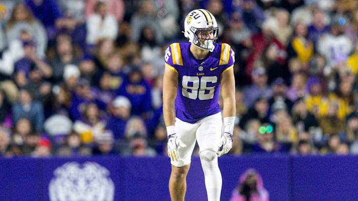 Nov 30, 2024; Baton Rouge, Louisiana, USA; LSU Tigers tight end Mason Taylor (86) looks on against the Oklahoma Sooners during the first quarter at Tiger Stadium. Mandatory Credit: Stephen Lew-Imagn Images Nov 30, 2024; Baton Rouge, Louisiana, USA; LSU Tigers tight end Mason Taylor (86) looks on against the Oklahoma Sooners during the first quarter at Tiger Stadium. Mandatory Credit: Stephen Lew-Imagn Images