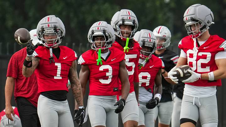 Ohio State Buckeyes wide receivers, from left, Brandon Inniss (1), Devin McCuin (3), Chris Henry Jr. (15), DeZie Jones (8) and David Adolph (82) work out during the first practice of training camp at the Woody Hayes Athletic Center in Columbus on Aug. 6, 2026. Ohio State Buckeyes wide receivers, from left, Brandon Inniss (1), Devin McCuin (3), Chris Henry Jr. (15), DeZie Jones (8) and David Adolph (82) work out during the first practice of training camp at the Woody Hayes Athletic Center in Columbus on Aug. 6, 2026.