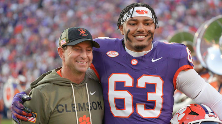 Clemson head coach Dabo Swinney with TJ Parker before kickoff with Furman University at Memorial Stadium in Clemson, SC, Saturday, November 22, 2025. Clemson head coach Dabo Swinney with TJ Parker before kickoff with Furman University at Memorial Stadium in Clemson, SC, Saturday, November 22, 2025.
