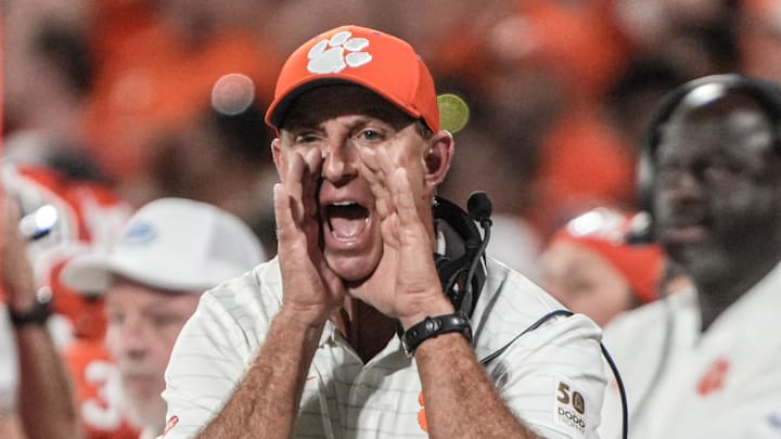 Clemson head coach Dabo Swinney communicates with a referee in the game with Louisiana State University during the second quarter at Memorial Stadium in Clemson, S.C., Saturday, Aug 30, 2025.