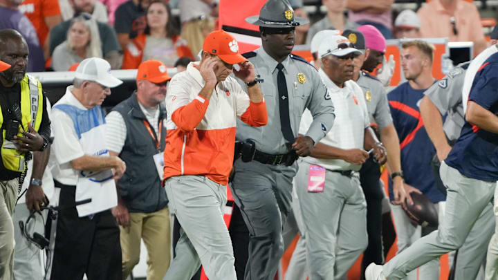 Oct 18, 2025; Clemson, South Carolina, USA; Clemson Tigers head coach Dabo Swinney walks over to meet Southern Methodist Mustangs head coach Rhett Lashlee (not shown) after the game at Memorial Stadium. Mandatory Credit: Ken Ruinard-GREENVILLE NEWS-USA TODAY Network via Imagn Images