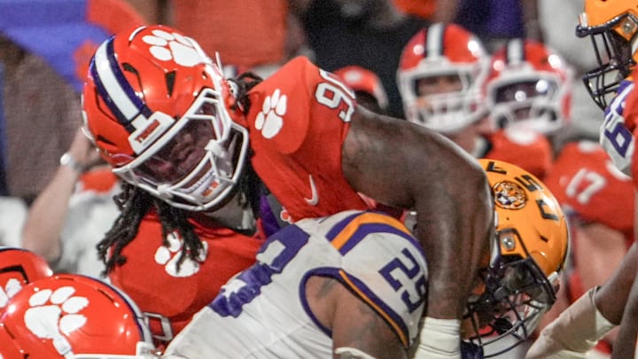 Clemson defensive end Stephiylan Green (90) tackles Louisiana State University running back Caden Durham (29) during the fourth quarter at Memorial Stadium in Clemson, S.C. Saturday, August 30, 2025.