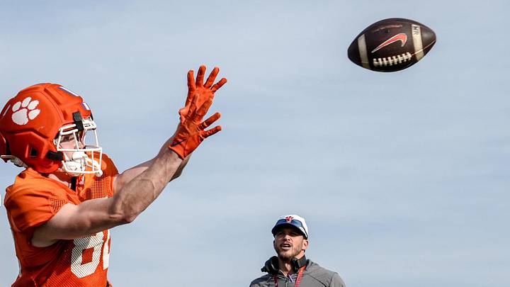 Clemson wide receiver Sam Earle (82) gets ready to catch a ball near wide receiver coach Tyler Grisham during Spring football practice at the Reeves Football Complex in Clemson, SC Wednesday, March 4, 2026.
