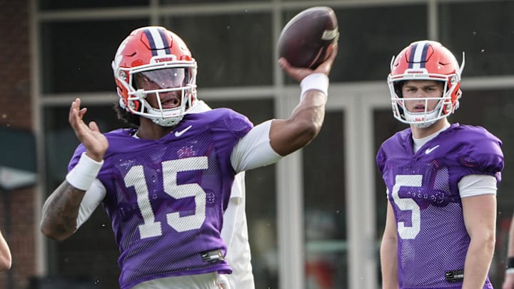 Clemson quarterback Chris Denson (15) goes through a rep while Brock Bradley (5) looks on during Wednesday's practice.
