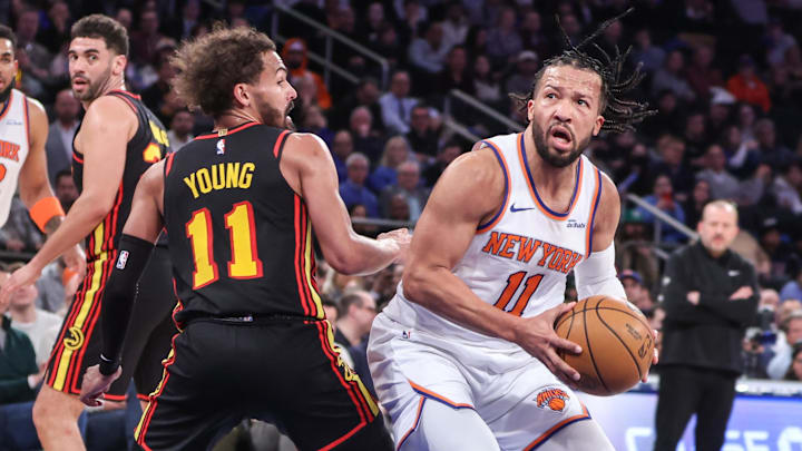 Feb 12, 2025; New York, New York, USA;  New York Knicks guard Jalen Brunson (11) looks to post up against Atlanta Hawks guard Trae Young (11) in the second quarter at Madison Square Garden. Mandatory Credit: Wendell Cruz-Imagn Images