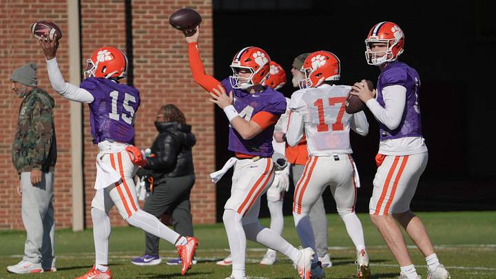 Clemson quarterback Chris Denson (15), left, quarterback Trent Pearman (14), and quarterback Christopher Vizzina (17) in a passing drill during the Pinstipe Bowl practice in Clemson, S.C. Monday, Dec. 15, 2025. Clemson quarterback Chris Denson (15), left, quarterback Trent Pearman (14), and quarterback Christopher Vizzina (17) in a passing drill during the Pinstipe Bowl practice in Clemson, S.C. Monday, Dec. 15, 2025.