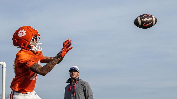 Clemson wide receiver JuJu Preston (10) gets ready to catch a ball near wide receiver coach Tyler Grisham. Clemson wide receiver JuJu Preston (10) gets ready to catch a ball near wide receiver coach Tyler Grisham.