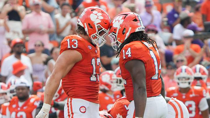Clemson defensive end Will Heldt (13) taps helmets with defensive end London Merritt (14) after sacking University of North Carolina quarterback Billy Edwards Jr. (9) during the third quarter at Memorial Stadium in Clemson, S.C. Saturday, September 19, 2026.