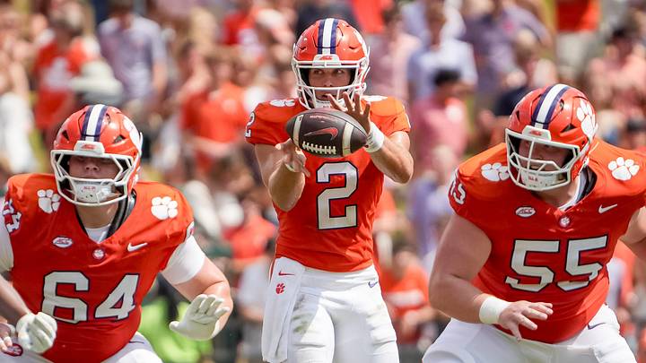 Clemson quarterback Tait Reynolds (2) takes a snap between linemen offensive lineman Grant Wise (64) and offensive lineman Harris Sewell (55) during the second quarter at Memorial Stadium in Clemson, S.C. Saturday, September 19, 2026. Clemson quarterback Tait Reynolds (2) takes a snap between linemen offensive lineman Grant Wise (64) and offensive lineman Harris Sewell (55) during the second quarter at Memorial Stadium in Clemson, S.C. Saturday, September 19, 2026.