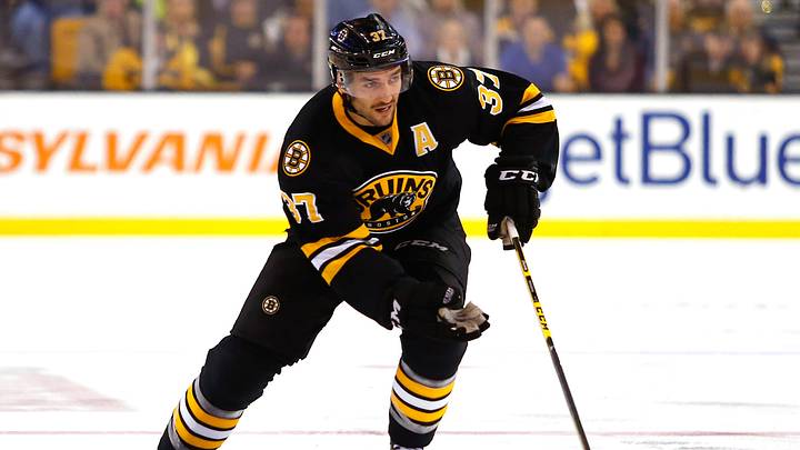 Nov 24, 2014; Boston, MA, USA; Boston Bruins center Patrice Bergeron (37) skates the puck against the Pittsburgh Penguins during the first period at TD Garden. Mandatory Credit: Winslow Townson-USA TODAY Sports