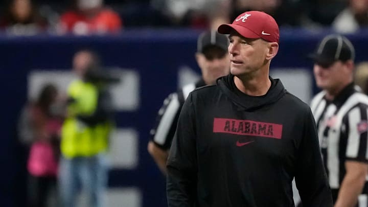 Dec 6, 2025; Atlanta, GA, USA; Alabama head coach Kalen DeBoer watches the Crimson Tide warm up before the SEC Championship Game at Mercedes-Benz Stadium. Mandatory Credit: Gary Cosby Jr.-Tuscaloosa News Dec 6, 2025; Atlanta, GA, USA; Alabama head coach Kalen DeBoer watches the Crimson Tide warm up before the SEC Championship Game at Mercedes-Benz Stadium. Mandatory Credit: Gary Cosby Jr.-Tuscaloosa News
