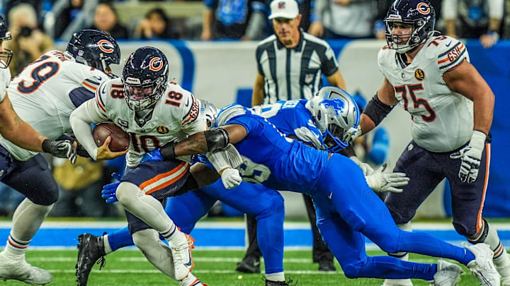 Chicago Bears quarterback Caleb Williams (18) is sacked by Detroit Lions defensive end Za'Darius Smith (99) in the fourth quarter on Thanksgiving Day at Ford Field in Detroit on Thursday, Nov. 28, 2024. Chicago Bears quarterback Caleb Williams (18) is sacked by Detroit Lions defensive end Za'Darius Smith (99) in the fourth quarter on Thanksgiving Day at Ford Field in Detroit on Thursday, Nov. 28, 2024.