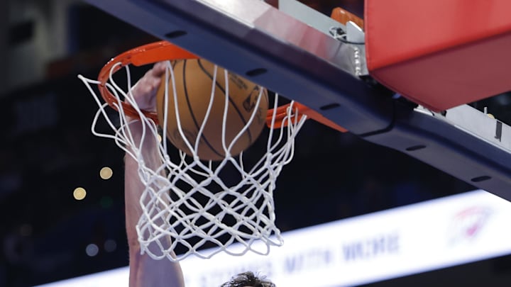 Jan 5, 2026; Oklahoma City, Oklahoma, USA; Charlotte Hornets center PJ Hall (16) dunks against the Oklahoma City Thunder during the second half at Paycom Center. Mandatory Credit: Alonzo Adams-Imagn Images