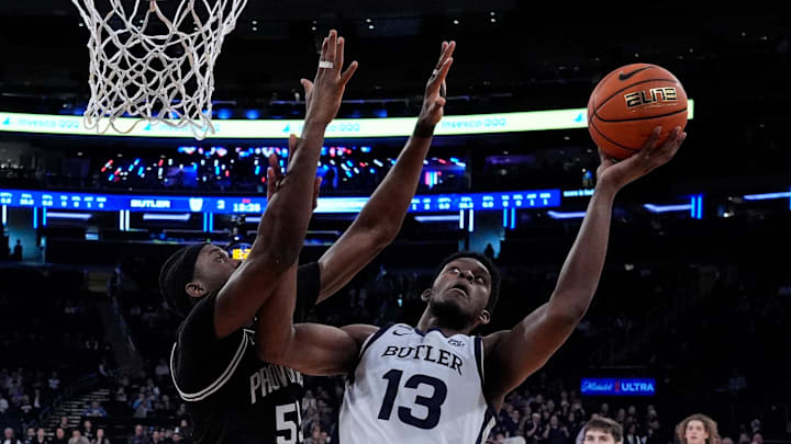 Mar 11, 2026; New York, NY, USA;  Butler Bulldogs center Drayton Jones (13) shoots over Providence Friars forward Oswin Erhunmwunse (55) during the first half at Madison Square Garden. Mandatory Credit: Robert Deutsch-Imagn Images