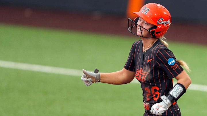Oklahoma State's Rosie Davis (26) celebrates a home run in the third inning of Game 2 of the NCAA softball tournament Stillwater Super Regional between the Oklahoma State Cowgirls and the Arizona Wildcats in Stillwater, Okla., Saturday, May, 25, 2024.