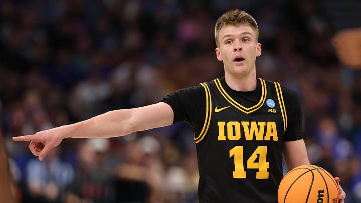 Mar 22, 2026; Tampa, FL, USA; Iowa Hawkeyes guard Bennett Stirtz (14) directs the offense against the Florida Gators in the first half during a second round game of the men's 2026 NCAA Tournament at Benchmark International Arena. Mandatory Credit: Matt Pendleton-Imagn Images