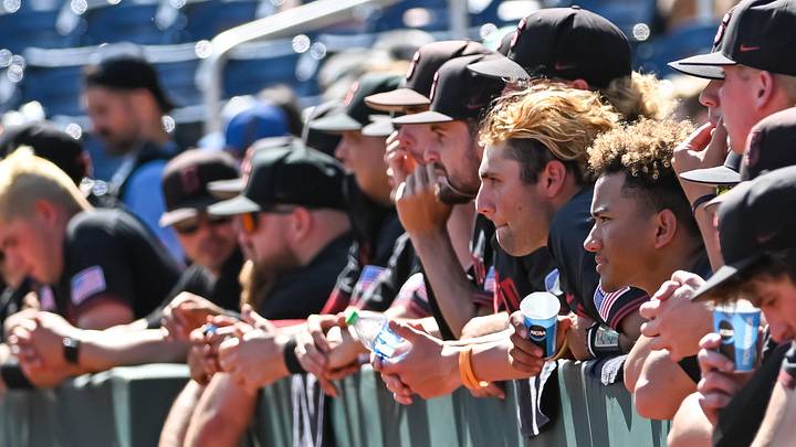 Jun 20, 2022; Omaha, NE, USA;  The Stanford Cardinal dugout watches action against the Auburn Tigers in the ninth inning at Charles Schwab Field. Mandatory Credit: Steven Branscombe-Imagn Images