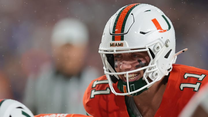Sep 20, 2025; Miami Gardens, Florida, USA; Miami Hurricanes quarterback Carson Beck (11) reacts before the snap against the Florida Gators during the first quarter at Hard Rock Stadium. Mandatory Credit: Sam Navarro-Imagn Images