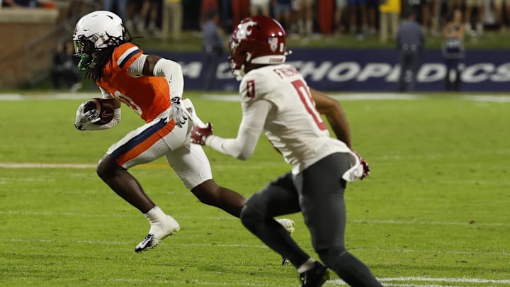 Oct 18, 2025; Charlottesville, Virginia, USA; Virginia Cavaliers defensive back Ja'Son Prevard (10) runs with the ball after intercepting a pass as Washington State Cougars wide receiver Tony Freeman (0) chases in the fourth quarter at Scott Stadium. Mandatory Credit: Geoff Burke-Imagn Images Oct 18, 2025; Charlottesville, Virginia, USA; Virginia Cavaliers defensive back Ja'Son Prevard (10) runs with the ball after intercepting a pass as Washington State Cougars wide receiver Tony Freeman (0) chases in the fourth quarter at Scott Stadium. Mandatory Credit: Geoff Burke-Imagn Images