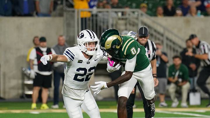 Sep 19, 2026; Fort Collins, Colorado, USA; BYU Cougars safety Tommy Prassas (22) attempts to tackle Colorado State Rams wide receiver Reginald Vick Jr. (0) in the second half at Sonny Lubick Field at Canvas Stadium. Mandatory Credit: Andrew Rydland-Imagn Images Sep 19, 2026; Fort Collins, Colorado, USA; BYU Cougars safety Tommy Prassas (22) attempts to tackle Colorado State Rams wide receiver Reginald Vick Jr. (0) in the second half at Sonny Lubick Field at Canvas Stadium. Mandatory Credit: Andrew Rydland-Imagn Images