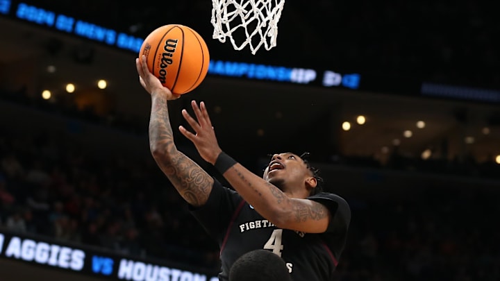 Mar 24, 2024; Memphis, TN, USA; Texas A&M Aggies guard Wade Taylor IV (4) shoots against the Houston Cougars in the second half in the second round of the 2024 NCAA Tournament at FedExForum. Mandatory Credit: Petre Thomas-Imagn Images