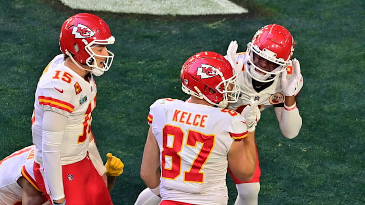 Feb 12, 2023; Glendale, Arizona, US; Kansas City Chiefs tight end Travis Kelce (87) celebrates with quarterback Patrick Mahomes (15) and other teammates after catching a pass for a touchdown against the Philadelphia Eagles during the first quarter of Super Bowl LVII at State Farm Stadium. Mandatory Credit: Matt Kartozian-Imagn Images