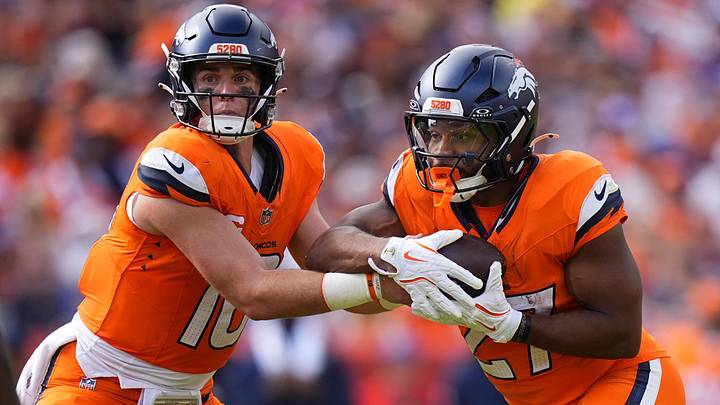 Sep 7, 2025; Denver, Colorado, USA; Denver Broncos running back J.K. Dobbins (27) receives a handoff from quarterback Bo Nix (10) during the second half at Empower Field at Mile High. 