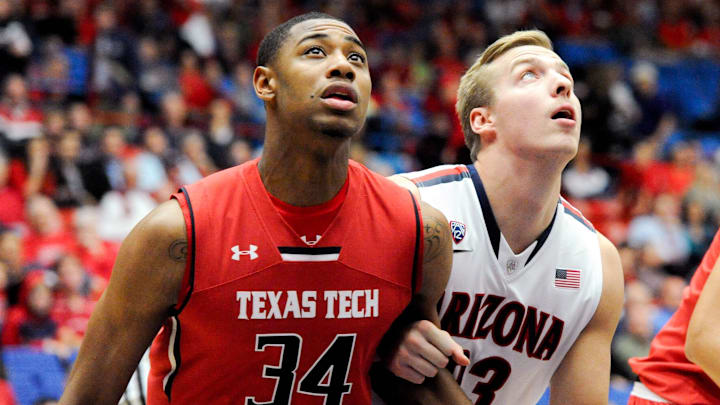 Dec 3, 2013; Tucson, AZ, USA; Texas Tech Red Raiders forward Alex Foster (34) and Arizona Wildcats forward Zach Peters (33) battle for positioning during a free throw attempt during the second half at McKale Center. Arizona defeated Texas Tech 79-58. Mandatory Credit: Casey Sapio-Imagn Images