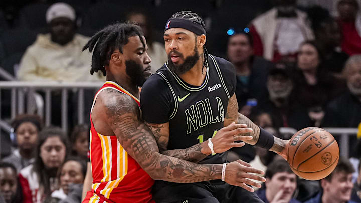 Mar 10, 2024; Atlanta, Georgia, USA; New Orleans Pelicans forward Brandon Ingram (14) dribbles guarded by Atlanta Hawks forward Saddiq Bey (41) during the first half at State Farm Arena. Mandatory Credit: Dale Zanine-Imagn Images