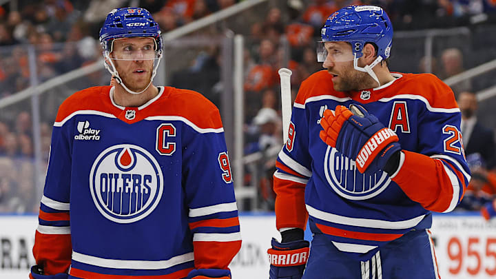 Sep 24, 2025; Edmonton, Alberta, CAN; Edmonton Oilers forward Connor McDavid (97) and forward Leon Draisaitl (29) discuss a play during a break in play against the Seattle Kraken at Rogers Place. Mandatory Credit: Perry Nelson-Imagn Images