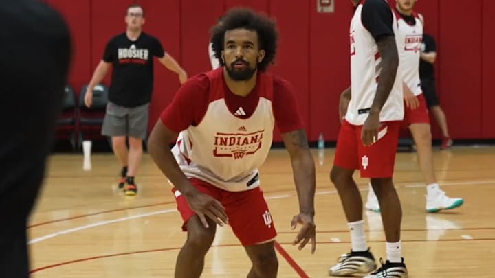 Tayton Conerway closes in to defend an inbounds pass during a recent Indiana men's basketball workout at Cook Hall.