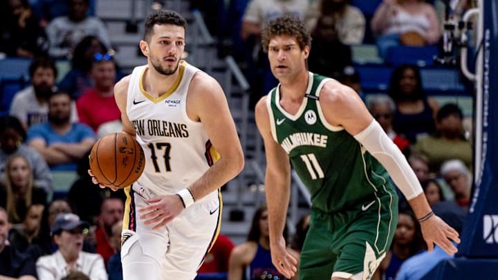 Apr 6, 2025; New Orleans, Louisiana, USA; New Orleans Pelicans center Karlo Matkovic (17) dribbles against Milwaukee Bucks center Brook Lopez (11) during the first half at Smoothie King Center. Mandatory Credit: Stephen Lew-Imagn Images