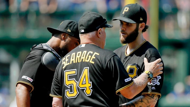 Jul 14, 2019; Chicago, IL, USA; Pittsburgh Pirates pitching coach Ray Searage (54) talks with starting pitcher Trevor Williams (34) after he gave up a two run home run to Chicago Cubs right fielder Jason Heyward (not pictured) during the fifth inning at Wrigley Field. Mandatory Credit: Jon Durr-USA TODAY Sports