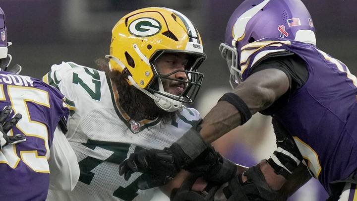 Green Bay Packers left tackleJordan Morgan (77) blocks Minnesota Vikings linebacker Dallas Turner during the fourth quarter. Green Bay Packers left tackleJordan Morgan (77) blocks Minnesota Vikings linebacker Dallas Turner during the fourth quarter.