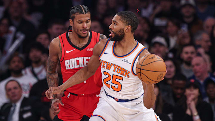 Feb 3, 2025; New York, New York, USA; New York Knicks forward Mikal Bridges (25) dribbles against Houston Rockets guard Jalen Green (4) during the first half at Madison Square Garden. Mandatory Credit: Vincent Carchietta-Imagn Images