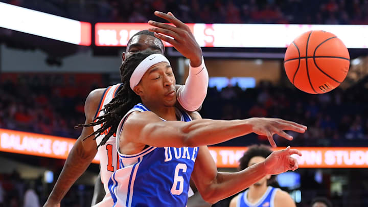 Feb 5, 2025; Syracuse, New York, USA; Duke basketball forward Maliq Brown (6) gets hit in the face by Syracuse Orange center Naheem McLeod (back) while reaching for the ball during the second half at the JMA Wireless Dome.