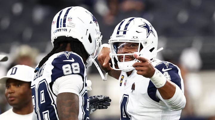 Oct 19, 2025; Arlington, Texas, USA; Dallas Cowboys quarterback Dak Prescott (4) speaks with wide receiver Ceedee Lamb (88) during warmups prior to the game against the Washington Commanders at AT&T Stadium. 